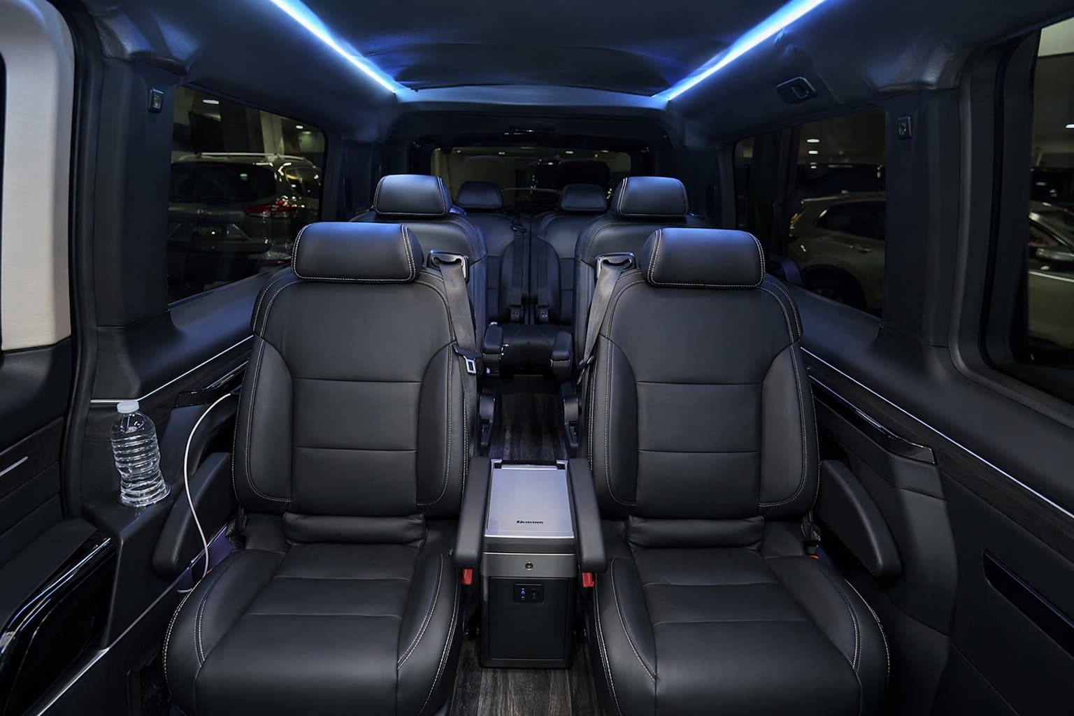 VIP van interior with premium leather seats and ambient blue LED lighting